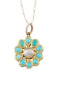 An Indian Jaipur enamel, turquoise and blister pearl pendant, inlaid to one side with turquoise