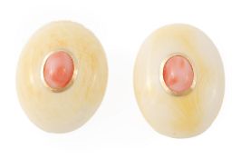 A pair of coral and ivory earrings, the central oval coral cabochons rub over set within domed