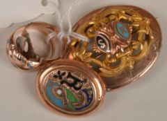 A pair of 20th century enamelled brooches and a pair of enamelled rings, with pressed scroll