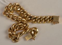 A broad curb link bracelet of plain polished finish, on a snap clasp, length 20.5cm, weight 34grams