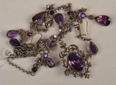 An amethyst and marcasite suite, comprising of a fringe necklace with foliate swags, a pendant with