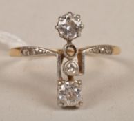 A diamond ring, circa 1930, vertically set with old brilliant-cut diamonds, (one stone missing),