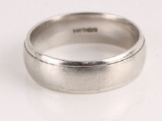 * A platinum wedding ring, of D section, 6.3mm wide, finger size R, 10g gross