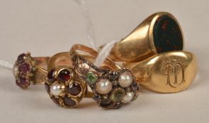 A Victorian cluster ring, composed of three half pearls (one missing), and a green and amethyst