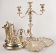 A quantity of electro-plated items, to include: a pair of three branch candelabra; an entree dish