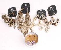 * A small collection of costume jewellery, four items on Topshop point of sale cards