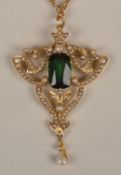 A late Victorian green stone and half pearl pendant, of openwork foliate design (brooch pin