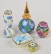 A collection of five Moorcroft enamel items, to include: a cream painted and electro-plate mounted