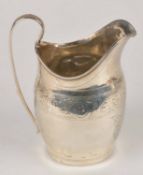 A George III silver ovoid cream jug, no maker`s mark, London 1799, with a high clip handle, a