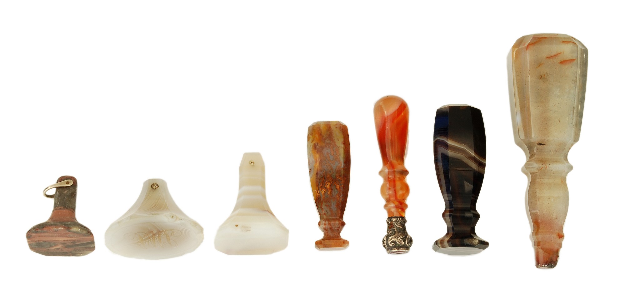 Seven small agate seals, 19th century, including: an orange banded desk example, with a chased