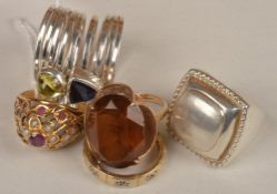 A small collection of rings, including a ruby and seed pearl ring, the raised pierced cone shaped