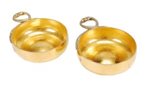 Tiffany, a pair of silver gilt wine tasters by Tiffany & Co., London 1960, incuse stamped `