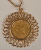 A sovereign pendant, dated 1888, within a floral wirework pendant frame, suspended on a flattened `