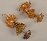 A pair of Victorian filigree work pendant earrings, the floral top and mid sections above a pierced