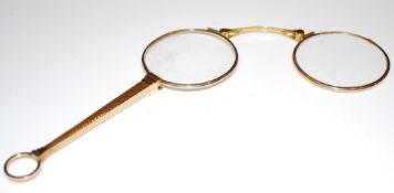 A gold lornette, stamped 10k, 20th century, 12cm long