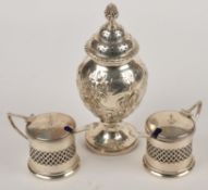 A late Victorian silver baluster caster by Charles Edwards, London 1900, with a cone finial to the