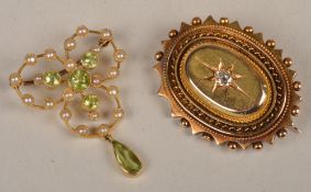 A late Victorian peridot and half pearl brooch, set with four graduated peridots with a pear shape