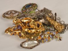 A collection of jewellery including a mourning brooch, the oval gilt metal scroll frame enclosing a