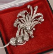 A mid 20th century diamond spray brooch, the pierced foliate designed panel pave set with diamonds