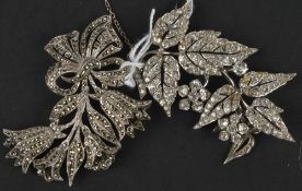 A white paste foliate spray brooch, composed of articulated sections of leaves and flowers, 8.5 cm