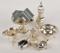 A small quantity of silver, to include: a silver faceted baluster caster by Robert Pringle & Sons,