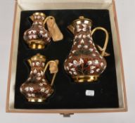 A graduated set of three Soviet Russian silver coloured gilt and enamel baluster jugs and covers,