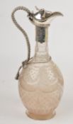 An electro-plate mounted baluster cut glass claret jug, with a rope bow finial, a rope scroll