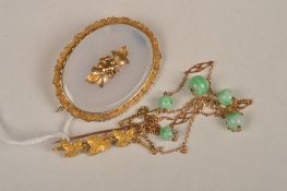 A Victorian gold brooch with applied engraved ivy leaf brooch, a Victorian gold and chalcedony