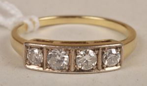 A four stone diamond ring, each brilliant-cut diamond in an individual box setting, to a tapered