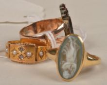 Three Victorian rings: an 18 carat gold cameo ring, finger size M; a 15 carat gold seed pearl ring,