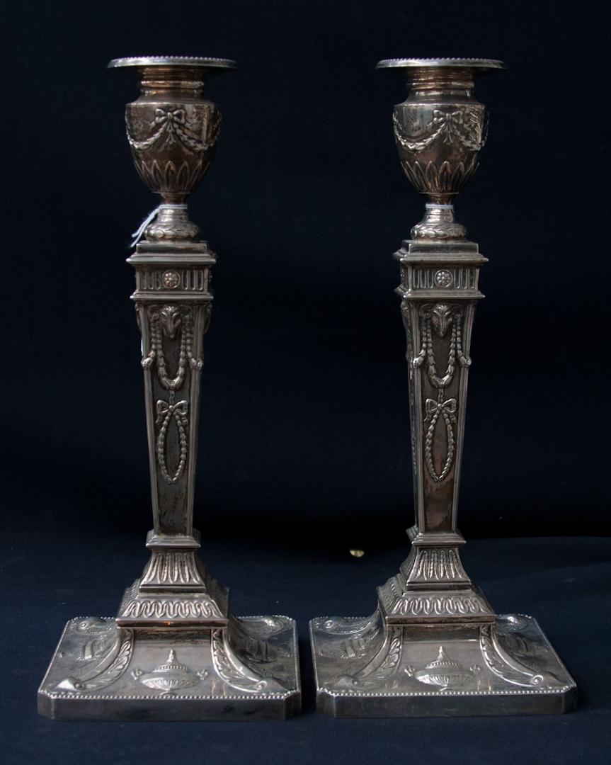 A Pair of Edwardian Style Silver Candlesticks, in the manner of Robert Adam, the sconces in the form