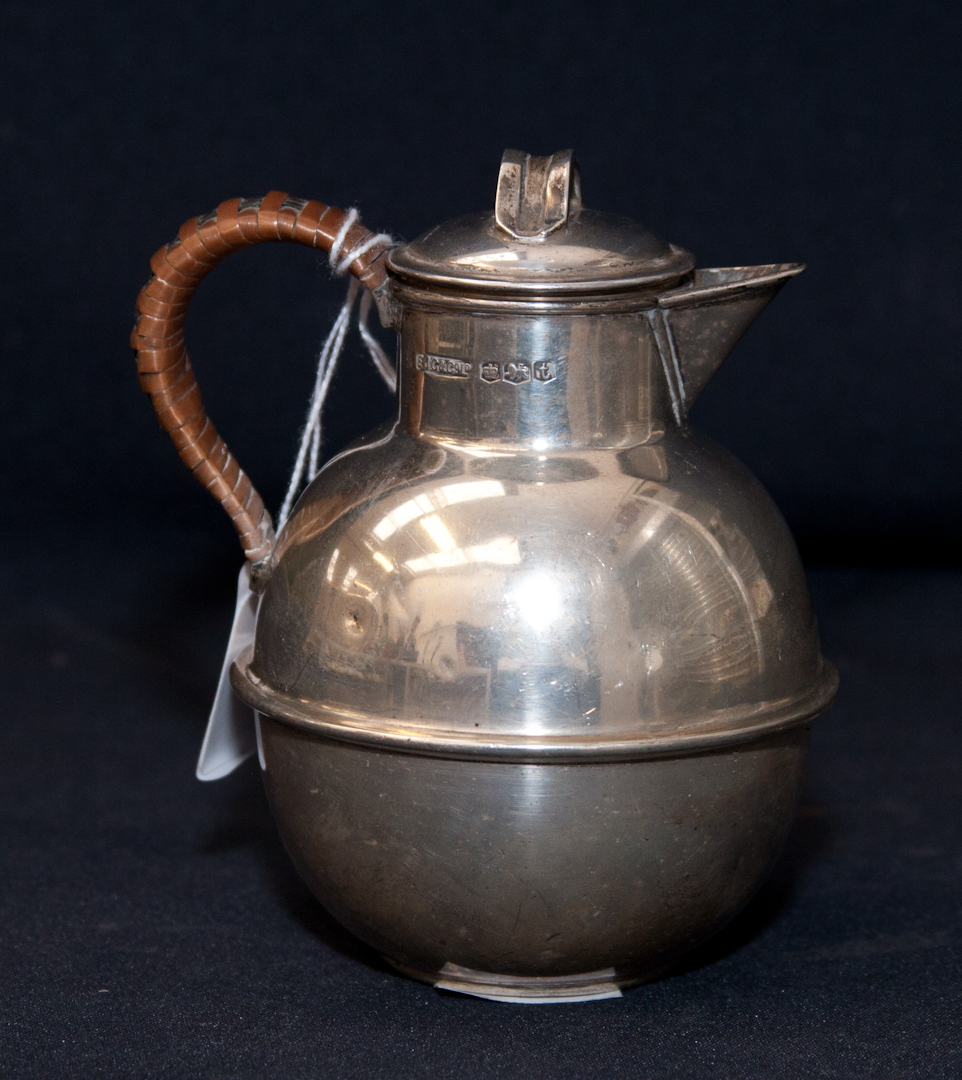 A silver hot water jug and cover with woven bamboo handle, weighing approx 5.32 toz, Sheffield 1936