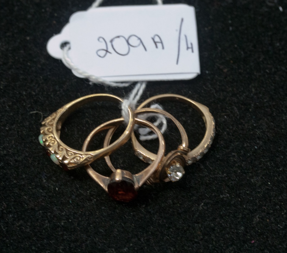 Four dress rings, three stamped 9ct, set with garnets, opals and paste (4)