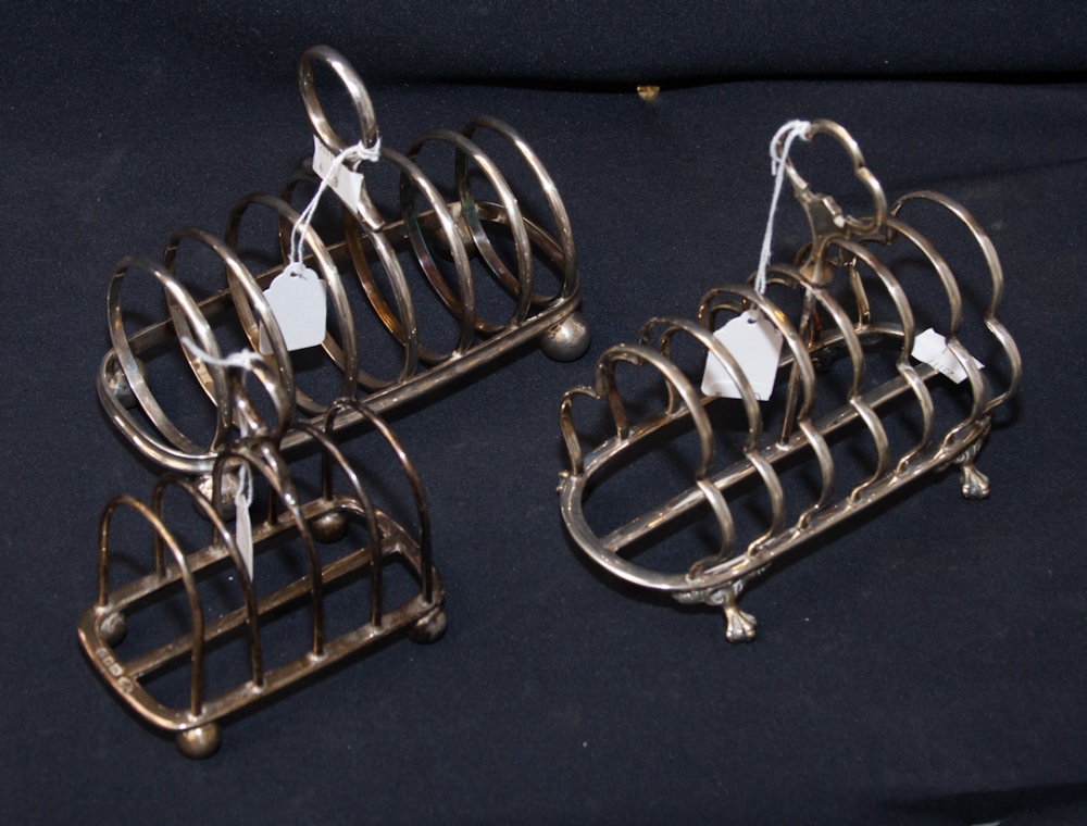 A Collection of Three Toast Racks, comprising one of four sections, with ring handle to top and
