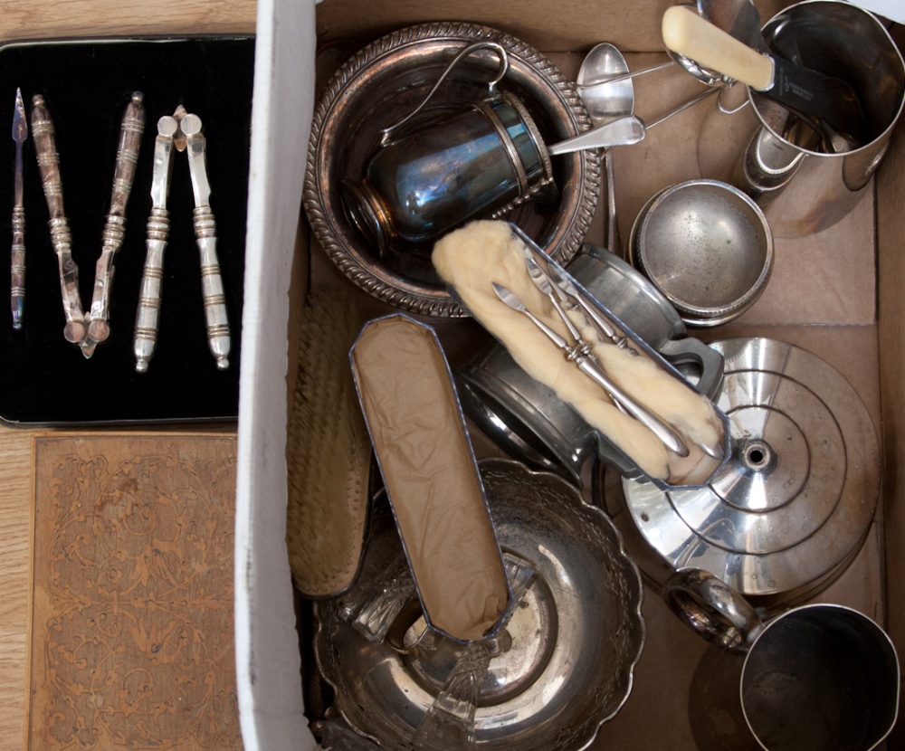 A Box Containing a Collection of Various Silver Plate, including white metal bottle coaster,