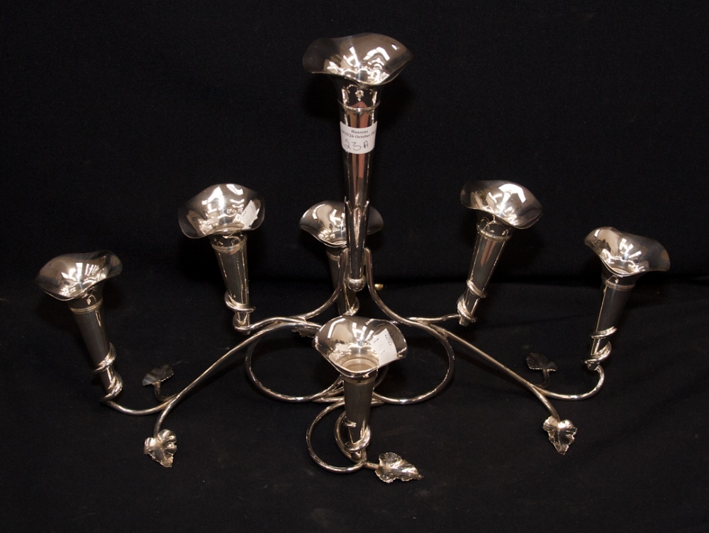 An Art Nouveau epergne with seven flutes.