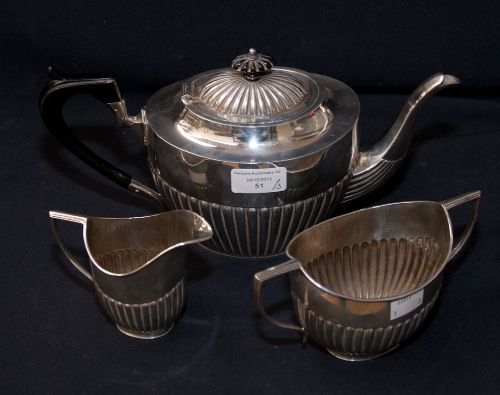 A Matched Three Piece Tea Service, comprising tea pot with ebony handle and ebony finial to lid,
