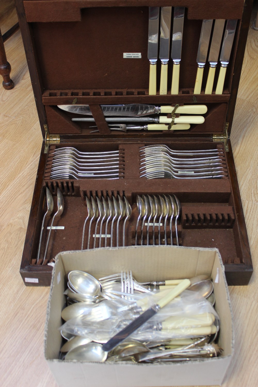 An oak canteen of EPNS cutlery, with a box of mostly EPNS flatware and silver collared fish knives