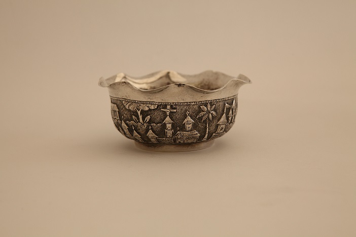An 18th century white metal bon bon dish, probably Indian Colonial, wavy rim, embossed with
