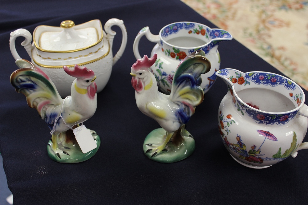 A pair of Mason style Chinoiserie jugs; a pair of Continental models of cockerels; a 19th century