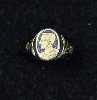 **IN RECEPTION** Belgian Interest - An early 20th century ring, inlaid with a portrait of King