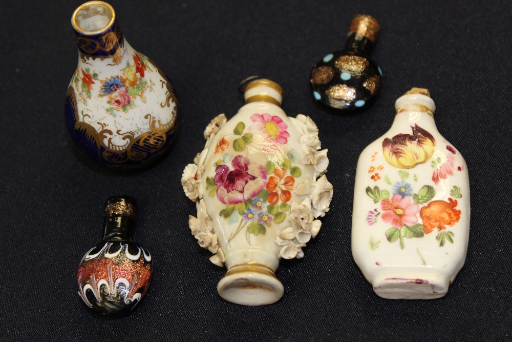 A Bloor Derby scent bottle, painted and applied with flowers; a miniature ovoid vase painted with