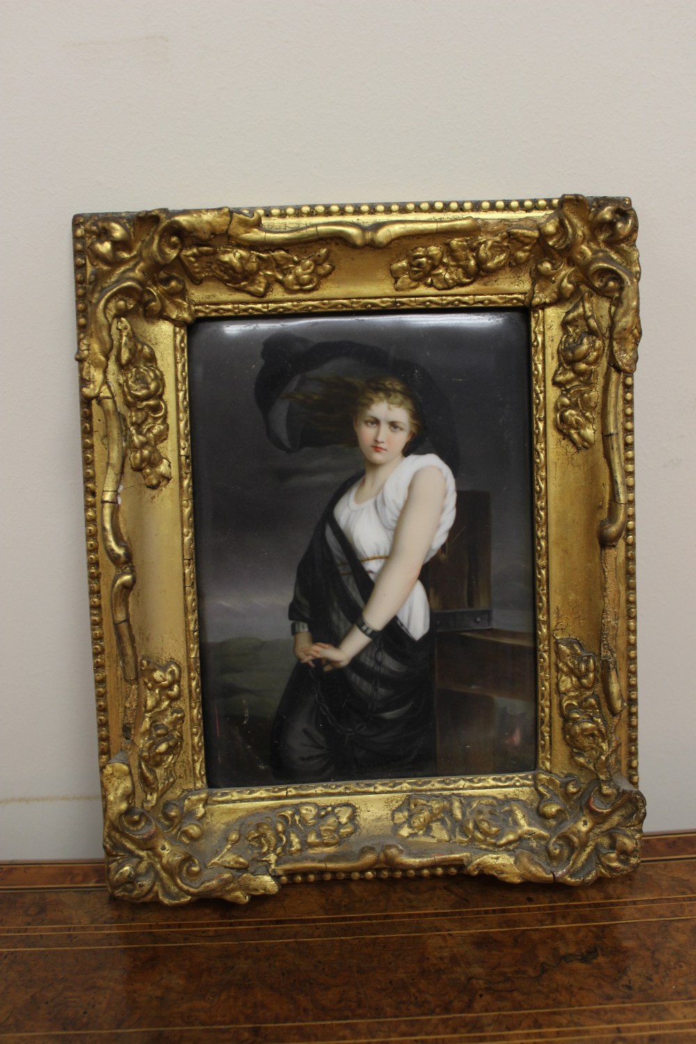 A 19th century Berlin porcelain plaque, depicting a lady in a white dress with black sheer wrap, her