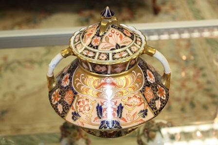 An Imari palette tapered vase and cover