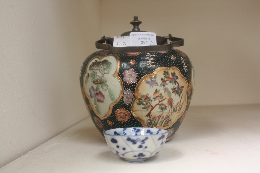 A late 19th Century blue and white Chinese tea bowl, diameter 7 cms approx, together with an early