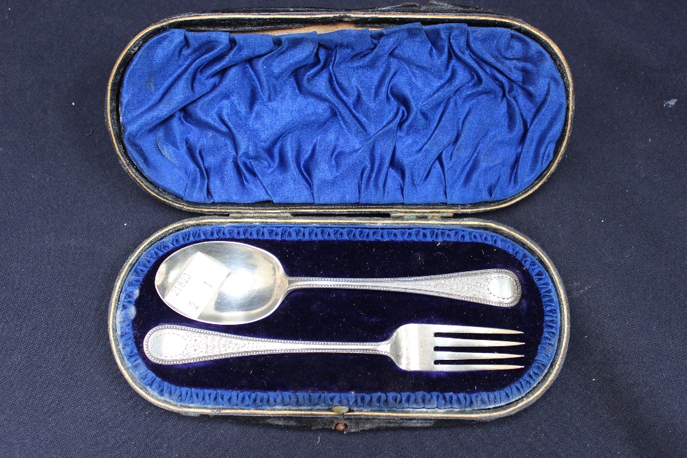 A cased silver spoon and fork set