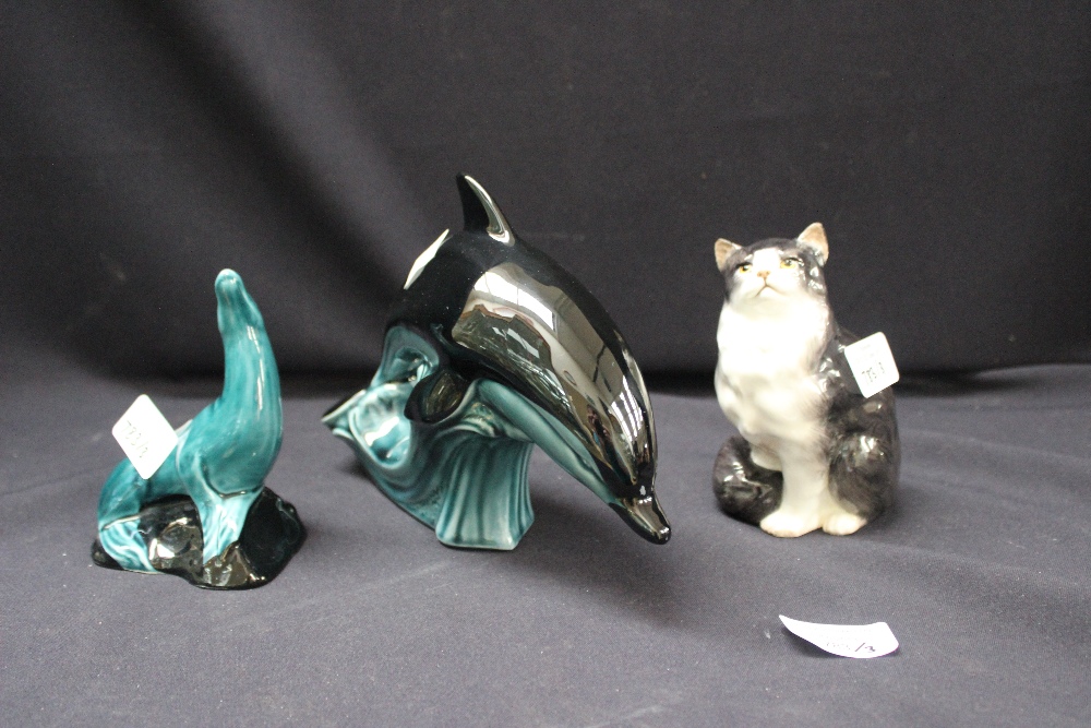 A Poole dolphin, a Poole seal and a Royal Doulton cat (3)