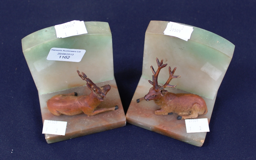 A pair of book ends - cold painted metal deer's, mounted on onyx