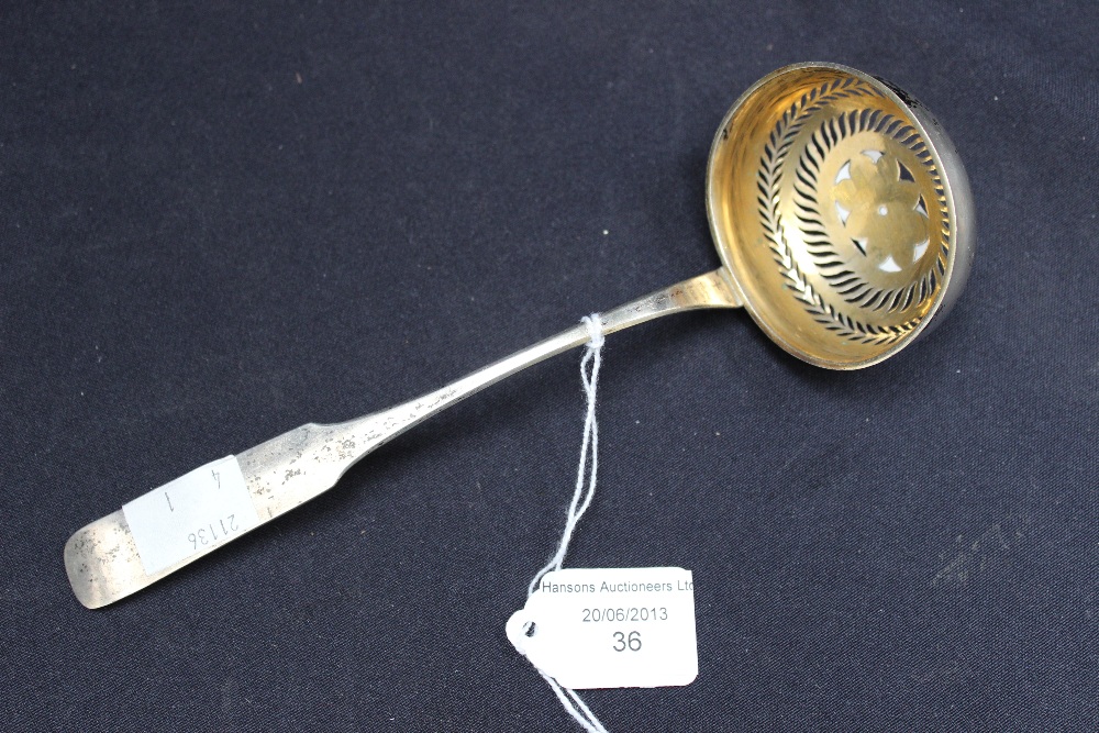 A German silver sifting spoon, approx 1.2ozt