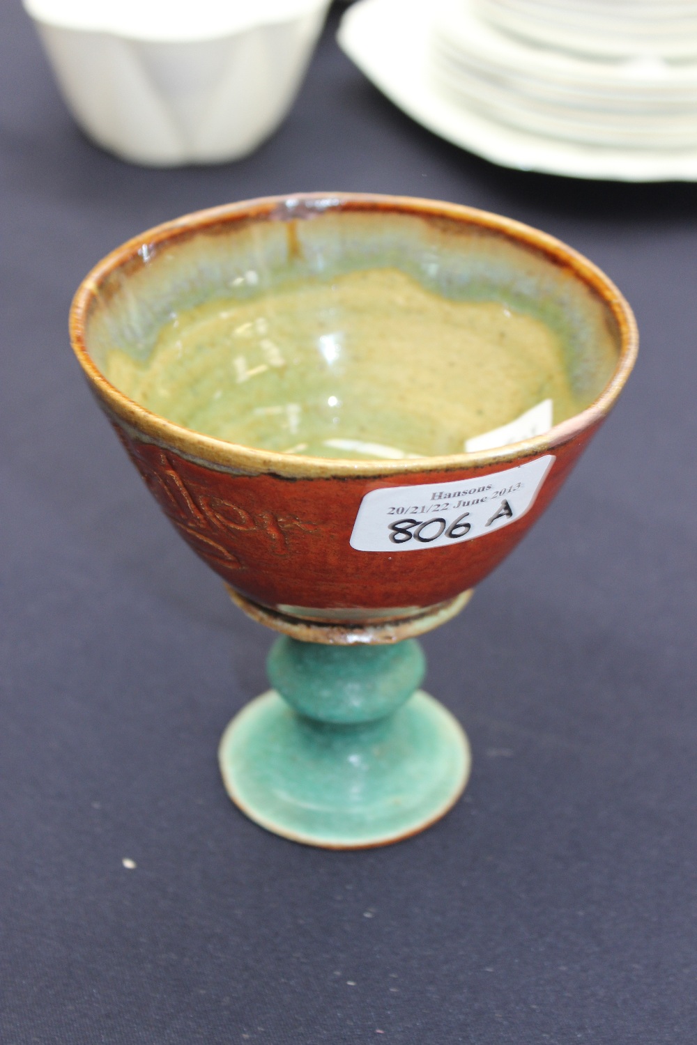 A Studio pottery stem cup inscribed 'holy water'.